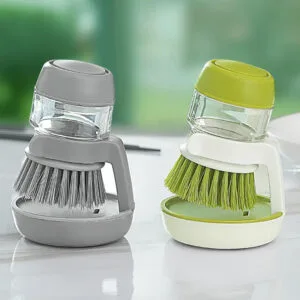 Cepillo lavavajillas con dispensador de jabón, ideal para vajilla, ollas y utensilios. Producto de Alemka Importaciones.